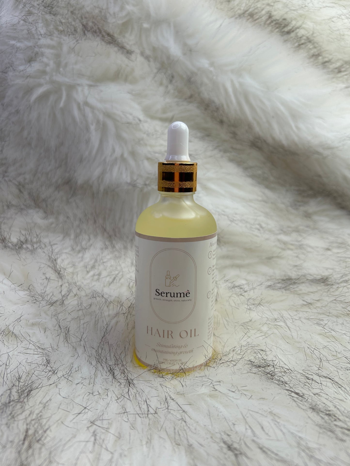 Individual picture of bottle of pre wash growth hair oil