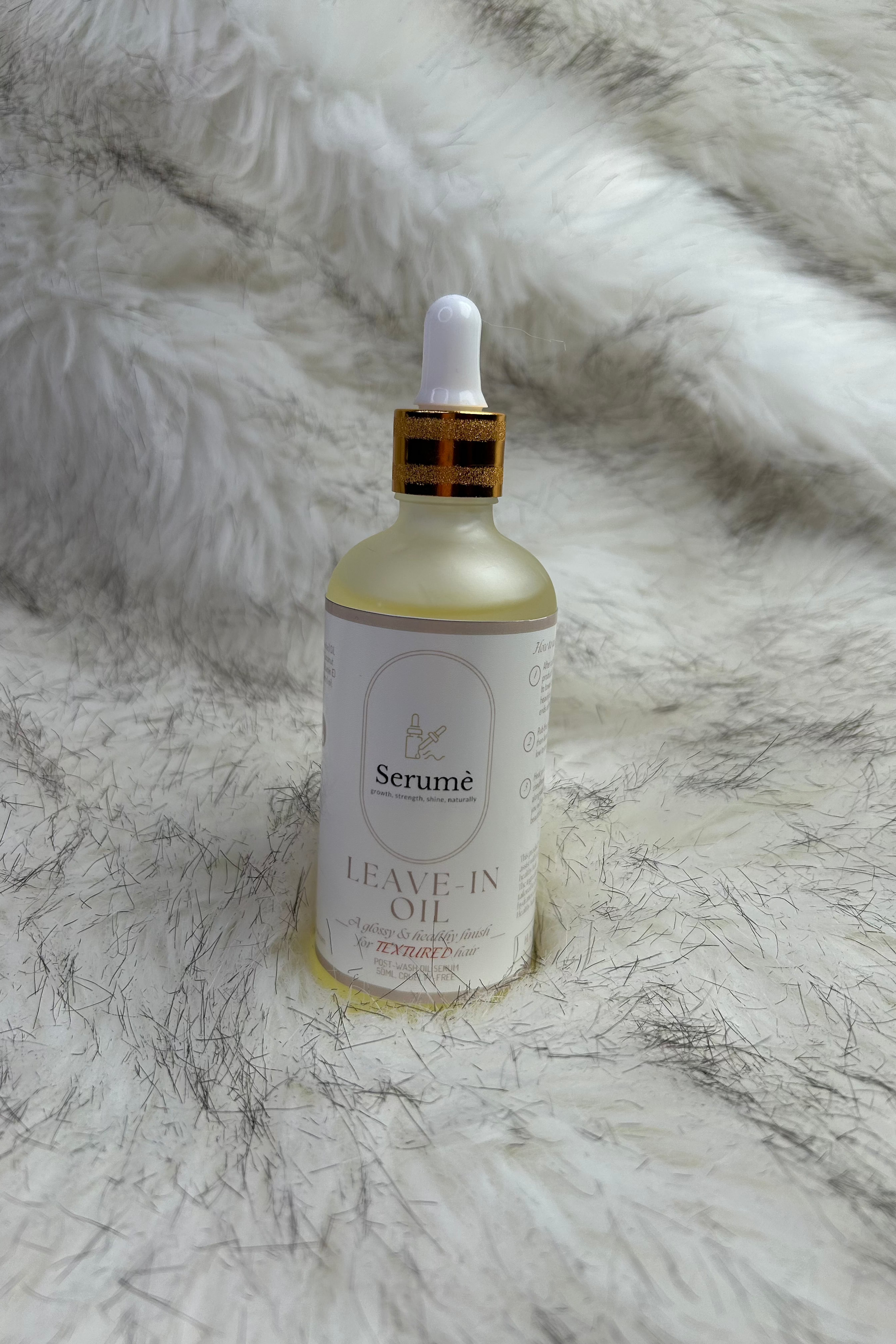 Textured hair leave-in bottle, single oil in picture